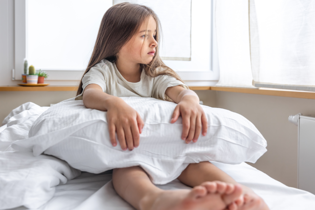 adorable-little-girl-in-her-bed-early-in-the-morning (1) 1.png